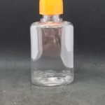 Frasco PET transparente base ovalada con tapa rosca naranja 50 cc