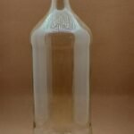 Botella de vidrio transparente base redonda 1 lt