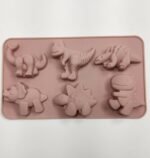 Molde de silicona color rosado de dinosaurios