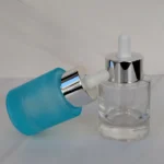 Frasco de vidrio gotario ancho con pipeta aluminio celeste y transparente