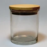 Pote de vidrio transparente con tapa de bamboo y sello para vela