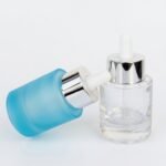Frasco de vidrio gotario ancho con pipeta aluminio celeste y transparente